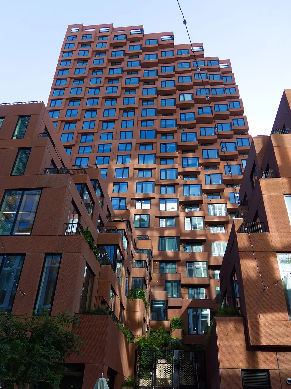 The Canyon at 1023 Third Street, Mission Rock, San Francisco — red-brown residential tower