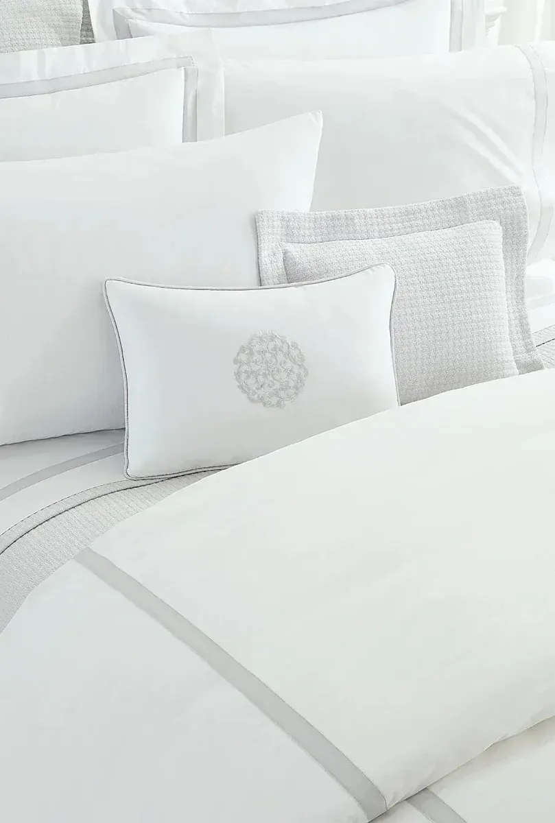 Folded Egyptian cotton bed linens after luxury bed linen cleaning in San Francisco